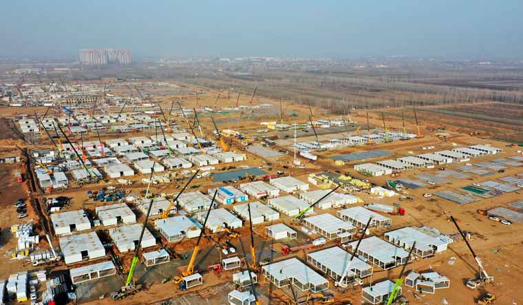 Shijiazhuang:In this aerial photo released by China's Xinhua News Agency, workers build a large centralized quarantine facility capable of holding several thousand people in Shijiazhuang in northern China's Hebei Province, Saturday, Jan. 16, 2021 | AP/PTI Photo