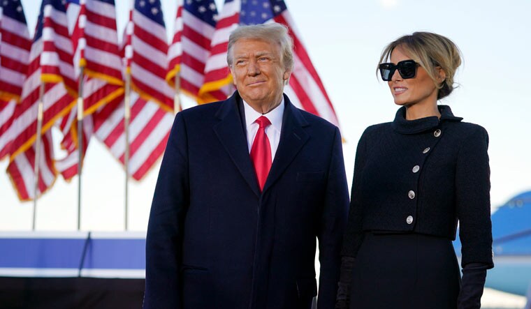President Donald Trump and first lady Melania Trump look at supporters before boarding Air Force One at Andrews Air Force Base, Md., Wednesday, Jan. 20, 2021 | AP Photo/Manuel Balce Ceneta)
