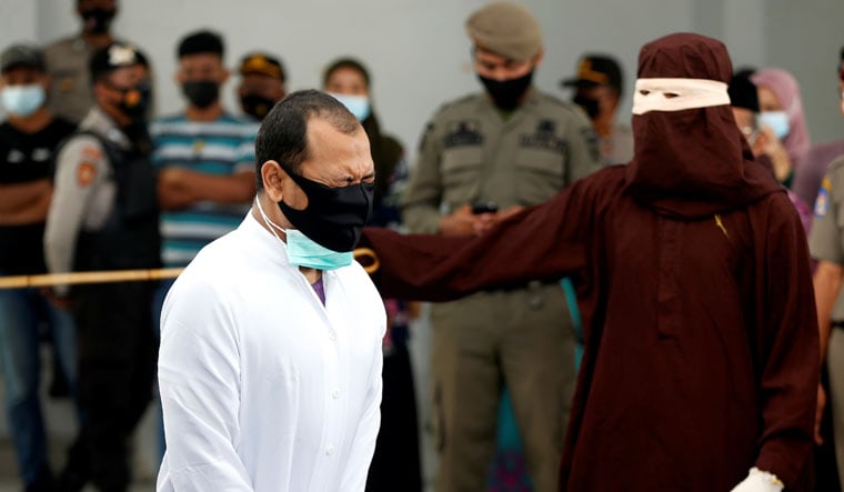 One of the 2 gay men being caned in Aceh | Reuters