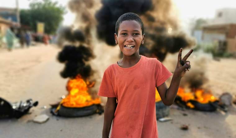 sudan-protests-coup-child-Khartoum-reuters