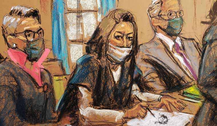 Ghislaine Maxwell, the Jeffrey Epstein associate accused of sex trafficking, makes a sketch of court artists during a pre-trial hearing ahead of jury selection, in a courtroom sketch in New York City, US, November 1, 2021 | Reuters