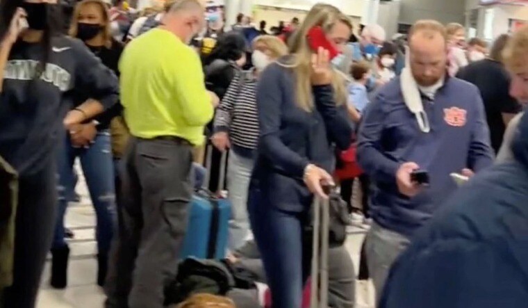 People gather to leave Hartsfield-Jackson Atlanta International Airport after reported shooting, in Atlanta, Georgia, U.S., November 20, 2021 | Reuters