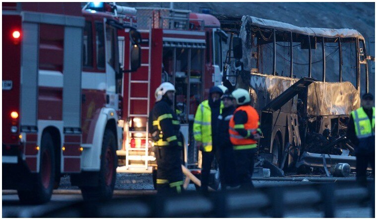 Rescue workers at the site of the crash | Reuters