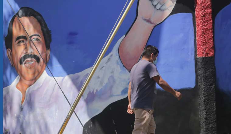 A man walks past a mural of Nicaraguan President Daniel Ortega during general elections in Managua, Nicaragua, Sunday, Nov. 7, 2021 | AP
