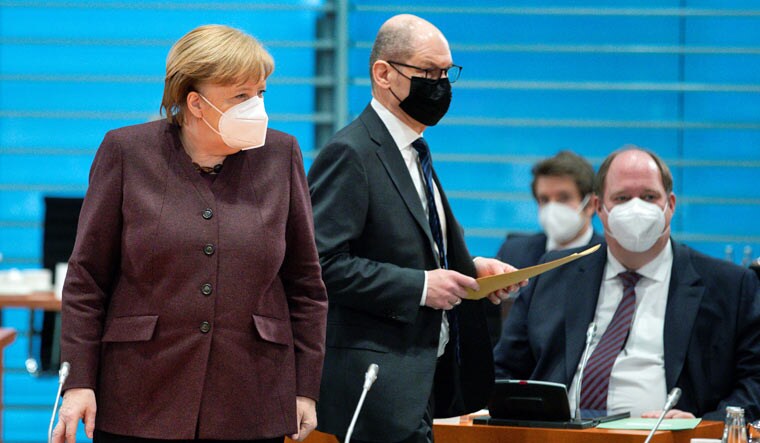 German Chancellor Angela Merkel, German Finance Minister Olaf Scholz, and Helge Braun, Head of the Chancellery, arrive for the weekly cabinet meeting in Berlin | Reuters