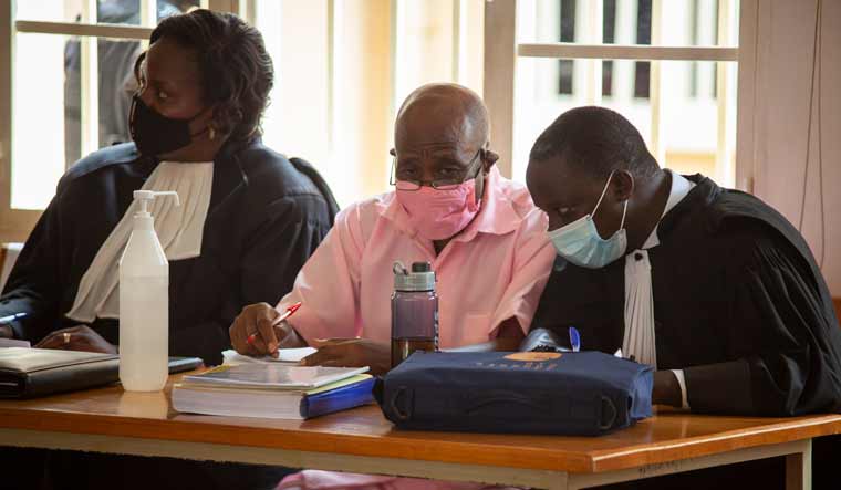 FILE - In this Sept. 25, 2020, file photo, Paul Rusesabagina, whose story inspired the film "Hotel Rwanda" for saving people from genocide, wears a pink prison uniform as he appears for a bail hearing at a court in the capital Kigali, Rwanda |AP Photo/Muhizi Olivier
