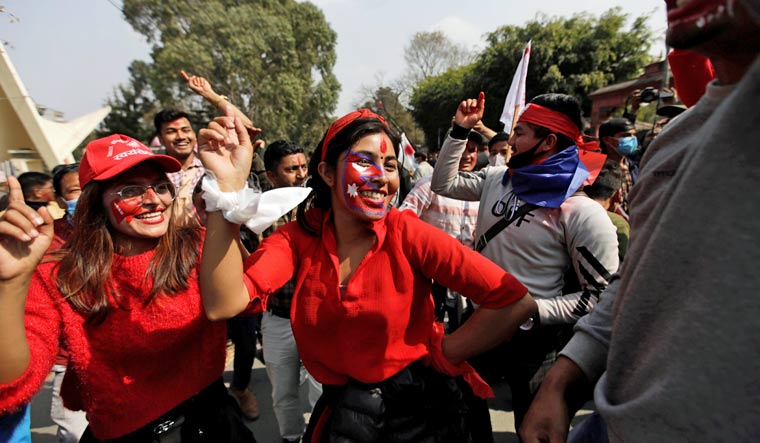Supporters of a faction of the ruling Nepal Communist Party take part in a rally celebrating the reinstatement of the parliament by Nepal's top court in Kathmandu | Reuters