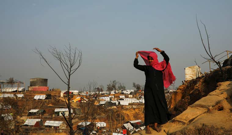 After losing her husband, two young sons and her home, Noor Banu fears she has lost another son to the massive blaze that ripped through the Cox's Bazar camps, reducing tarpaulin and bamboo shelters to ash | REUTERS/Mohammad Ponir Hossain 