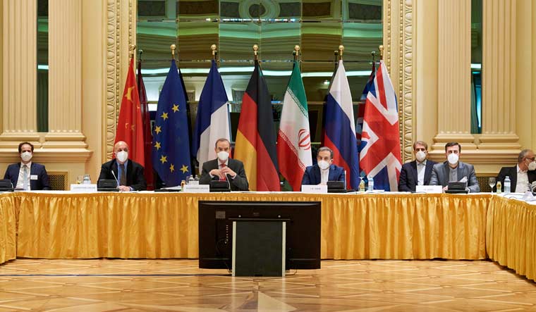 European External Action Service (EEAS) Deputy Secretary General Enrique Mora and Iranian Deputy at Ministry of Foreign Affairs Abbas Araghchi wait for the start of a meeting of the JCPOA Joint Commission in Vienna, Austria| Reuter