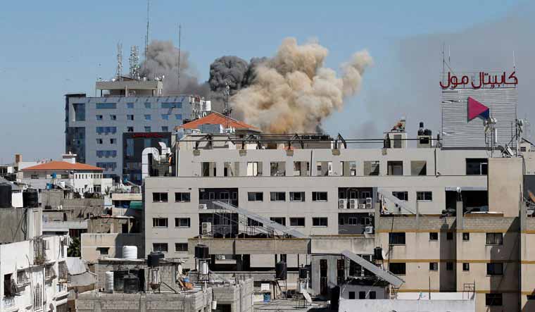 Smoke rises during an Israeli air strike, amid a flare-up of Israeli-Palestinian violence, in Gaza City | Reuters
