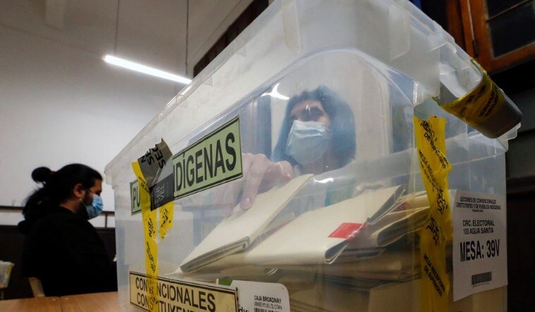 A poll worker in Chile | Reuters