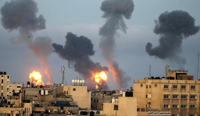 Flames and smoke rise during Israeli air strikes in the southern Gaza Strip | Reuters