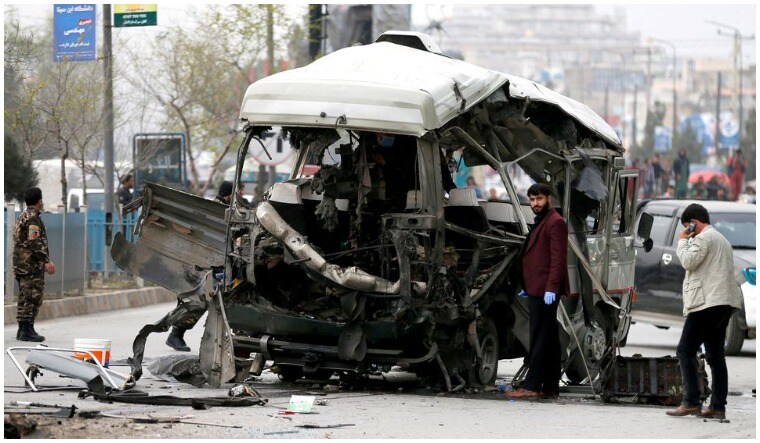 File: Afghan officials inspect a damaged minibus after a blast in Kabul, Afghanistan March 15, 2021 | Reuters
