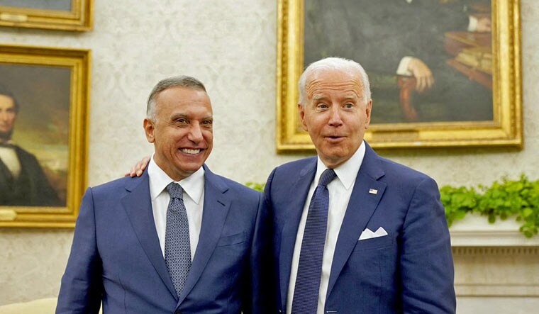 Iraq's Prime Minister Mustafa Al-Kadhimi with US President Joe Biden in the Oval Office of the White House in Washington, DC | AFP