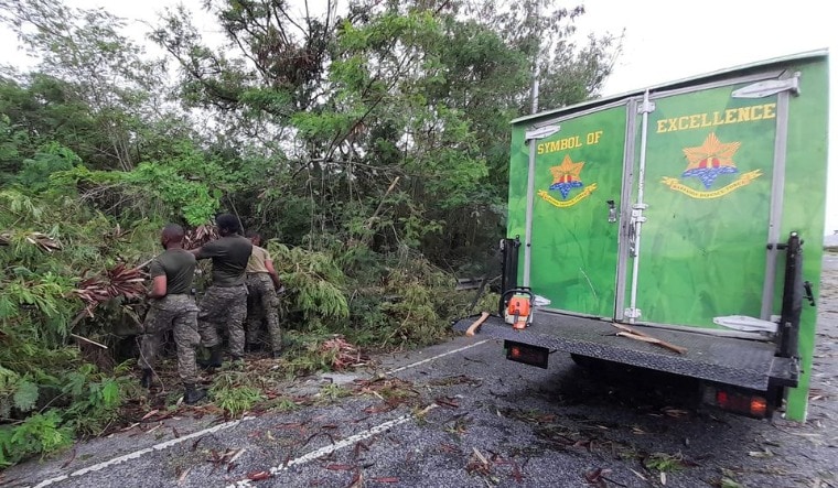 Barbados Defence Force soldiers clear a roadway after strong winds of Hurricane Elsa passed St. Michael, Barbados July 2, 2021 | Reuters
