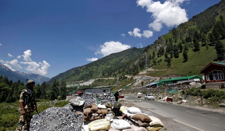 India's Border Security Force (BSF) soldiers stand guard at a checkpoint along a highway leading to Ladakh, at Gagangeer in Kashmir's Ganderbal district June 17, 2020 | Reuters
