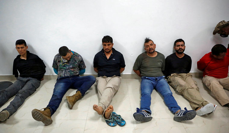 Suspects in the assassination of President Jovenel Moise, who was shot dead early Wednesday at his home, are shown to the media in Port-au-Prince, Haiti | Reuters