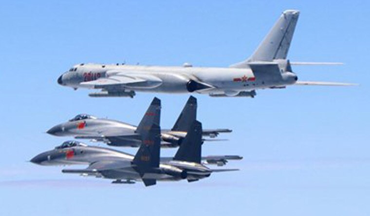 A Chinese H-6K bomber flanked by two J-11 fighters flying near Taiwan in 2018 | China's Ministry of National Defense