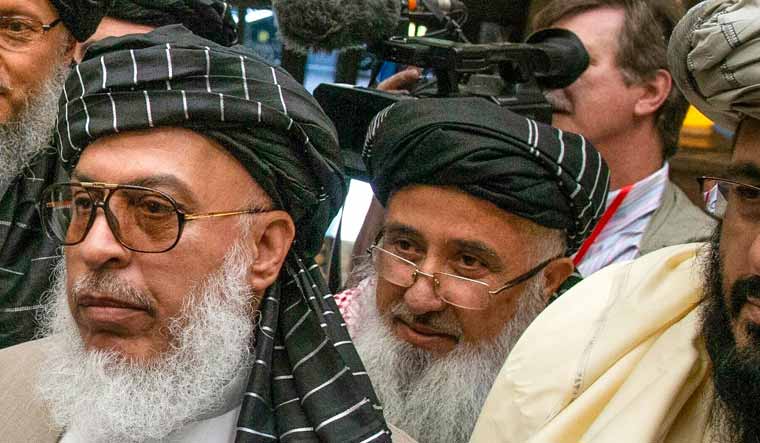 Sher Mohammad Abbas Stanikzai (on left) | AP