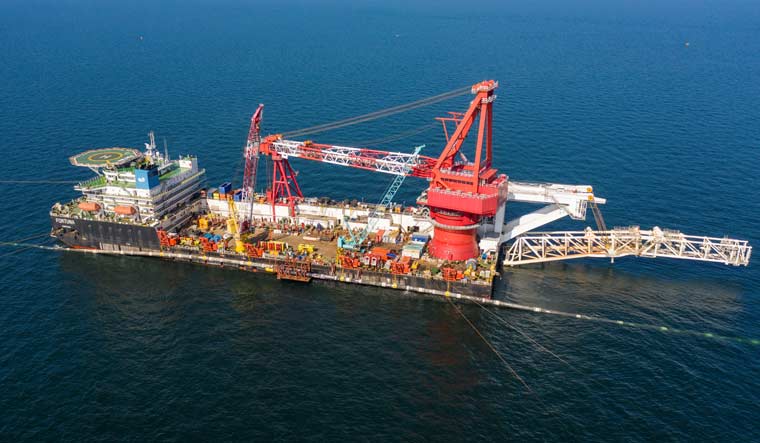 An aerial view shows specialists onboard the laybarge Fortuna performing an above-water tie-in while finishing the construction of the Nord Stream 2 gas subsea pipeline in the Baltic Sea, September 8, 2021 |Nord Stream 2/Handout via REUTERS 