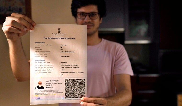 A boy displays his Covishield COVID-19 vaccination certificate in New Delhi, India, Wednesday, Sept. 22, 2021| AP