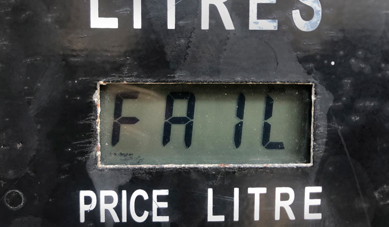 A screen on a gasoline pump reads, "Fail," after the latest increase in fuel prices with most meters unable to accommodate the new five digit price for one liter of gas, in Beirut, Lebanon, Wednesday, Sept. 22, 2021 | AP Photo/Hussein Malla