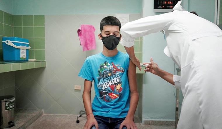 Cristian Artimbau, 14, gets a dose of the Soberana 02 vaccine during its clinical trials at a hospital amid concerns about the spread of the coronavirus disease (COVID-19) in Havana, Cuba, June 29, 2021 | Reuters