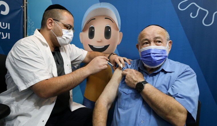 A man receives his third dose of the coronavirus disease (COVID-19) vaccine at a Clalit healthcare maintenance organisation in Jerusalem August 11,2021 | Reuters