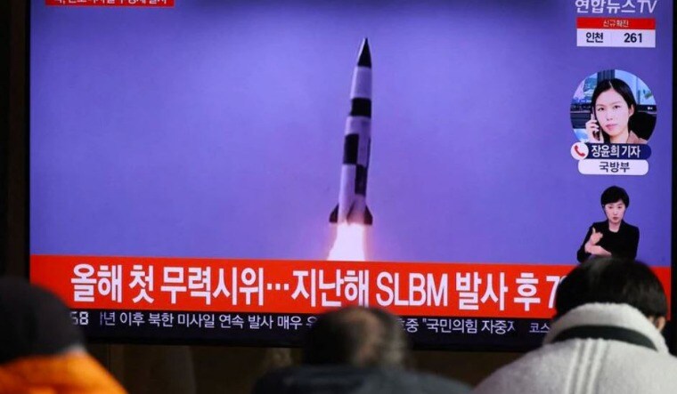 People watch a TV broadcasting file footage of a news report on North Korea firing a ballistic missile off its east coast, in Seoul, South Korea, January 5, 2022 | Reuters
