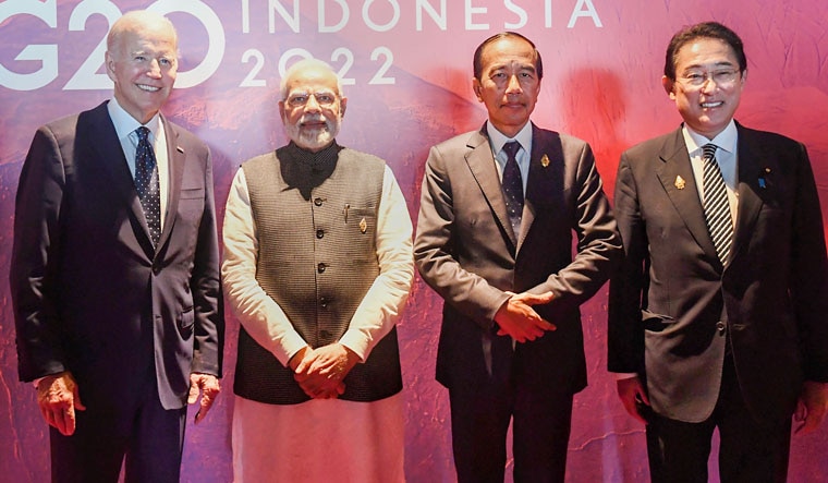 **EDS: IMAGE VIA PIB** Bali: Prime Minister Narendra Modi with Indonesian President Joko Widodo, US President Joe Biden and Japanese Prime Minister Fumio Kishida on the sidelines of the G20 Summit, in Bali, Indonesia, Tuesday, Nov. 15, 2022. (PTI Photo)(PTI11_15_2022_000224B)