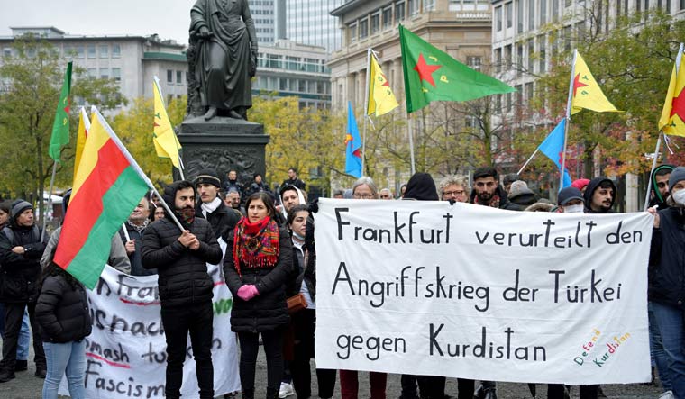 Representative image: Protesters hold a banner reading "Frankfurt condemns Turkey's war of aggression against Kurdistan" to protest against Turkey's military action during a pro-Kurdish demonstration in Frankfurt, Germany November 20, 2022 | Reuters