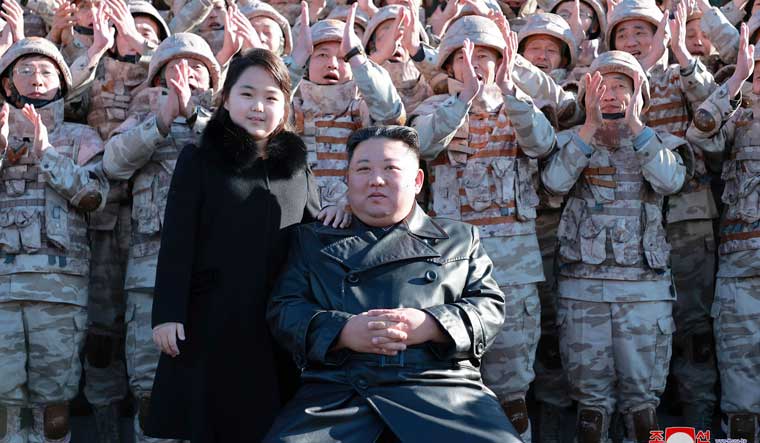 The undated photo provided on Nov. 27, 2022, by the North Korean government shows North Korean leader Kim Jong Un and his daughter with soldiers at the launch of what it says a Hwasong-17 intercontinental ballistic missile | AP