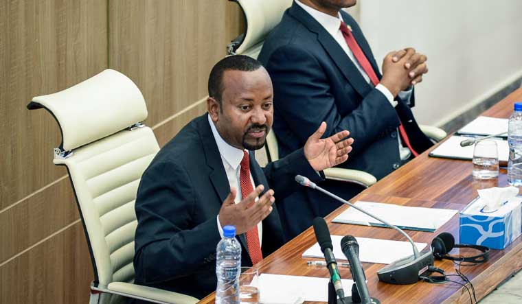 Ethiopia's Prime Minister Abiy Ahmed, left, accompanied by House speaker Tagesse Chafo, right, addresses the parliament in the capital Addis Ababa, Ethiopia on Nov. 15, 2022 | AP
