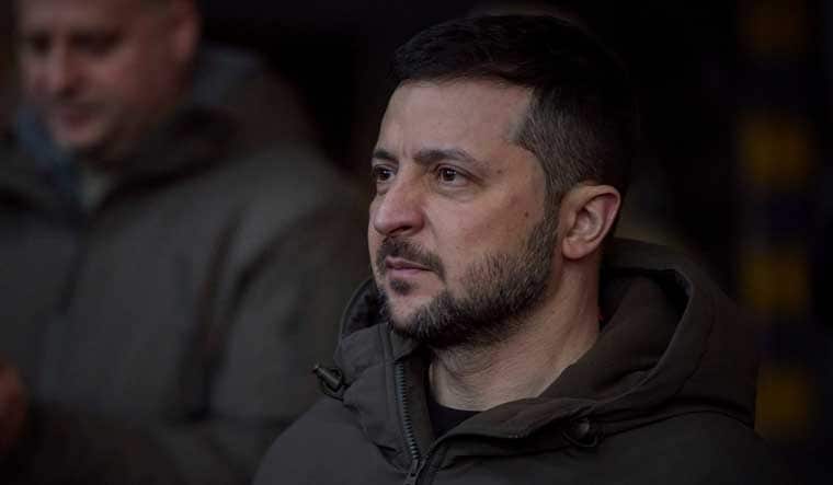 Ukrainian President Volodymyr Zelenskyy, looks on as he meets soldiers at the site of the heaviest battles with the Russian invaders in Bakhmut, Ukraine on Tuesday | AP