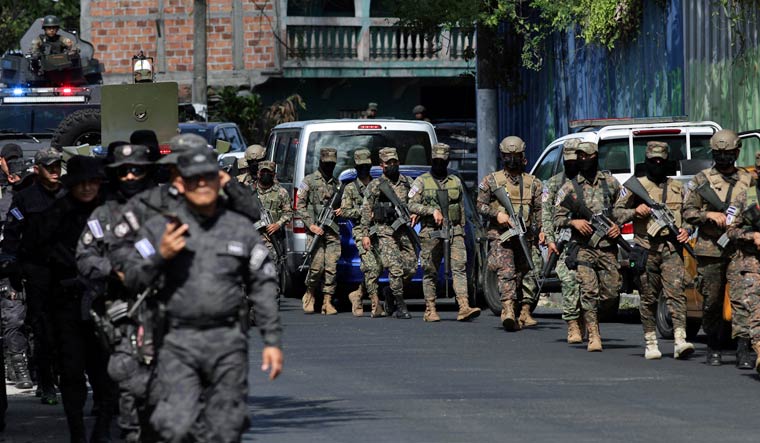 Soldiers arrive in Soyapango, El Salvador, Saturday, Dec. 3, 2022 | AP