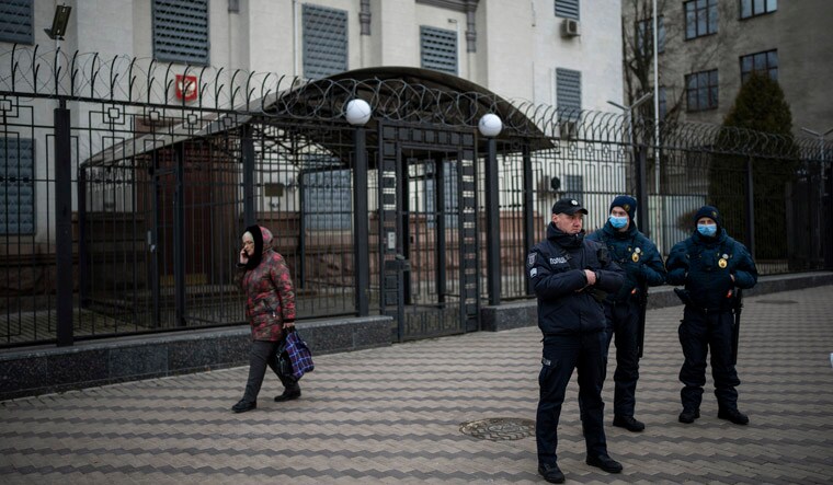 Ukrainian police officers stand guard in front of the Russian Embassy in Kyiv, Ukraine | AP