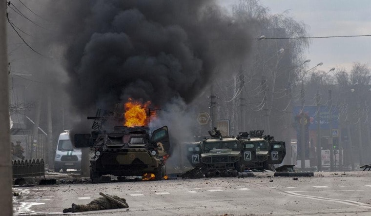 A Russian armored personnel carrier burns in Kharkiv | AP