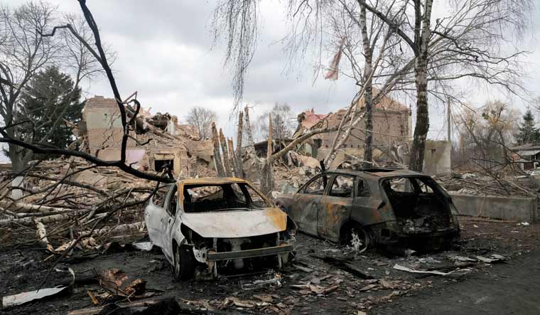 Gutted cars following a night air raid in the village of Bushiv, 40 kilometers west of Kyiv, Ukraine, Friday, March 4, 2022 | AP