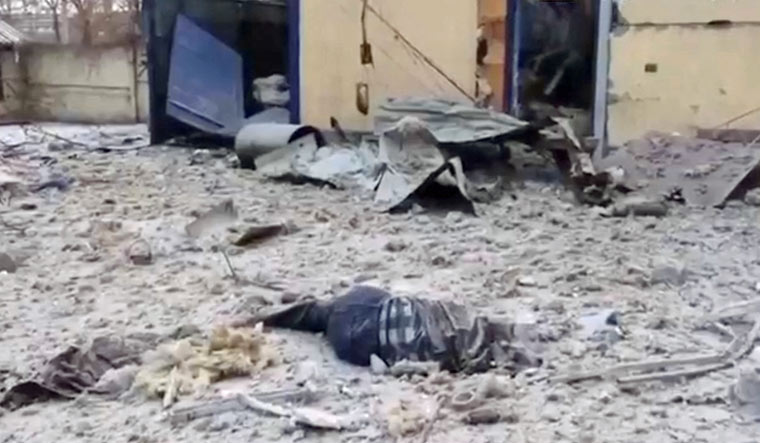 A body lies amid the debris after an airstrike, during the ongoing Russian invasion, in Novokodatsky district, Dnipro, Ukraine March 11, 2022 | Reuters