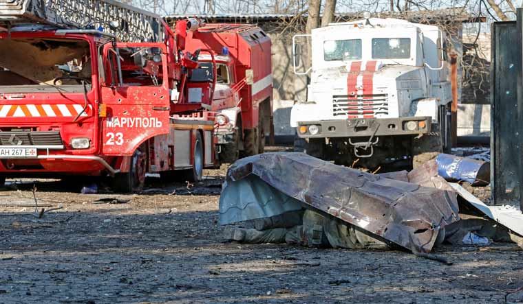 A view shows the body of a person, who was killed during Ukraine-Russia conflict, near a building of emergencies ministry department in the separatist-controlled town of Volnovakha in the Donetsk region, Ukraine March 12, 2022 | Reuters