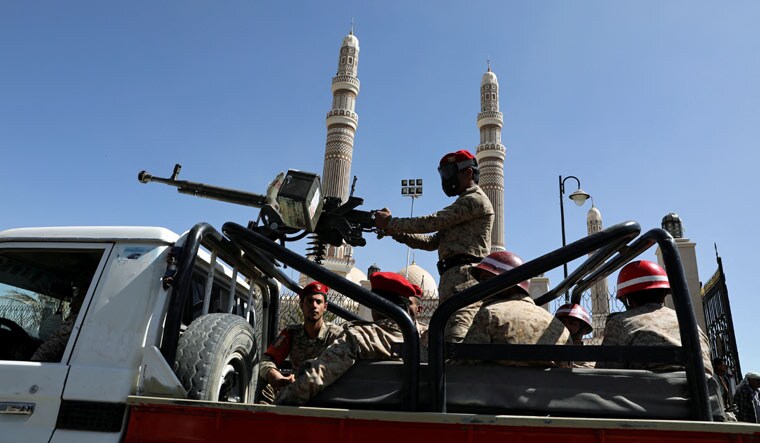 File: Military policemen ride on the back of a patrol truck at the site of a funeral of Houthi fighters killed during a fighting against government forces, in Sanaa, Yemen December 6, 2021 | Reuters
