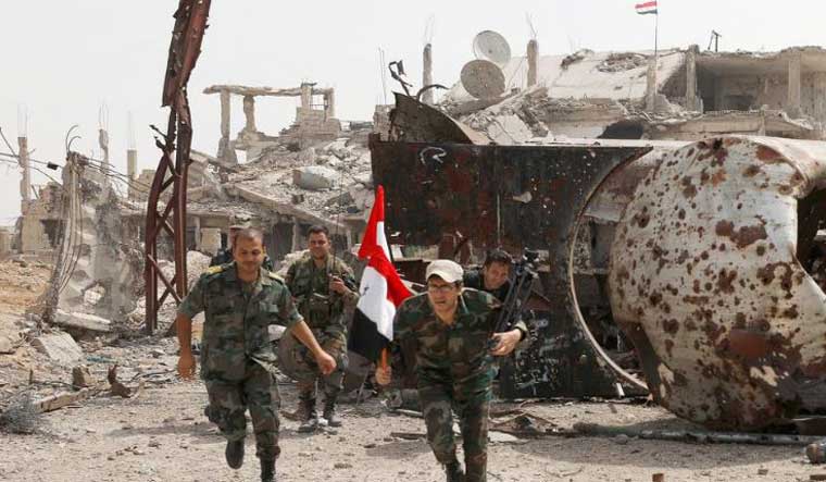 Syrian soldiers in Damascus in 2018 | Reuters