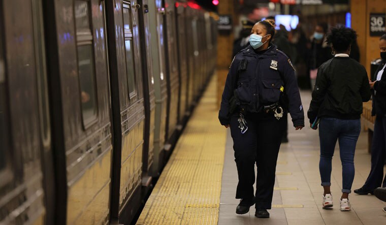 An NYPD officer patrols the subway platform at the 36 Street subway station on April 13, 2022 in the Sunset Park neighbourhood of Brooklyn | AFP