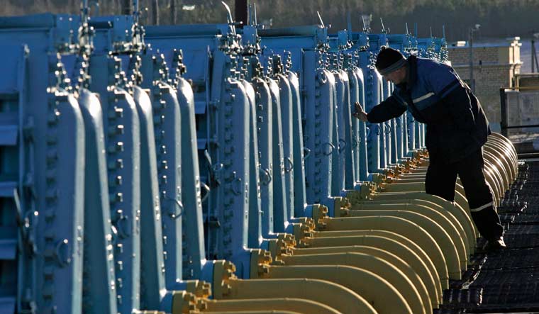 File: A Belarusian worker on duty at a gas compressor station of the Yamal-Europe pipeline near Nesvizh, some 130 km (81 miles) southwest of the capital Minsk, Belarus | AP