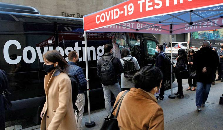 People wait in line to take coronavirus disease (COVID-19) tests at pop-up testing site in New York City, US, December 14, 2021 | Reuters