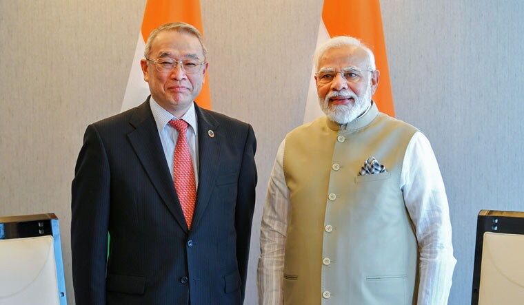 Prime Minister Narendra Modi with Chairman of NEC Corporation Nobuhiro Endo during a meeting in Tokyo. PM Modi is in Japan on a two-day visit to attend a summit of the Quad leaders | PTI