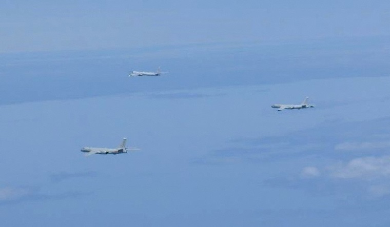 A Russian TU-95 bomber and Chinese H-6 bombers fly over East China Sea | Reuters