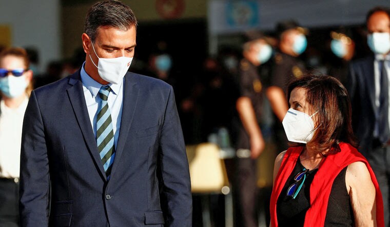 Spanish Prime Minister Pedro Sanchez and Spanish Minister of Defence Margarita Robles arrive to welcome Spanish diplomats, security staff and Afghan citizens evacuated from Kabul at Torrejon Air Base, outside Madrid, Spain, August 27, 2021 | Reuters