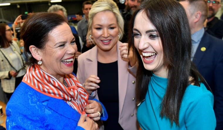 Sinn Fein deputy leader Michelle O'Neill, party leader Mary Louise McDonald and party candidate Emma Sheerin celebrate after Sinn Fein was voted as the largest party in Northern Ireland | Reuters