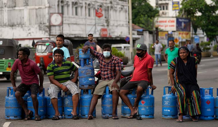 Sri Lankans block an intersection demanding cooking gas cylinders in Colombo | PTI